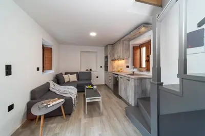 a living room with a couch and a table at Anastasia Deluxe Studio in Kattavía