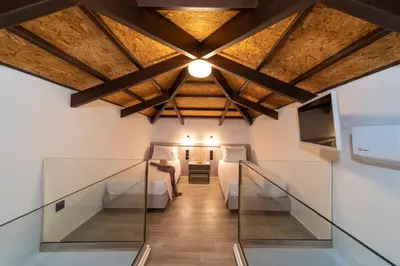 a hallway with a bed and a room at Anastasia Deluxe Studio in Kattavía