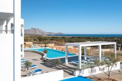 a villa with a swimming pool and a view of the ocean at Villa Zoe Blu in Kalathos