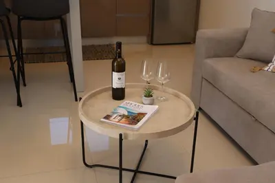 a table with a bottle of wine and two glasses at Merelia Luxury Guesthouse in Haraki