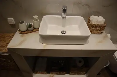 a white sink sitting on top of a bathroom counter at Merelia Luxury Guesthouse in Haraki