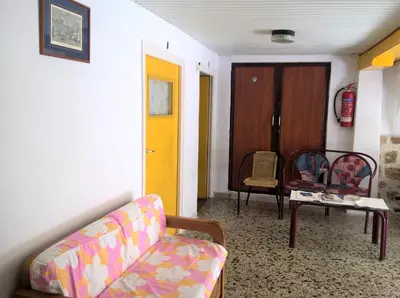 a living room with a couch and a table at Stathis in Rhodes Town