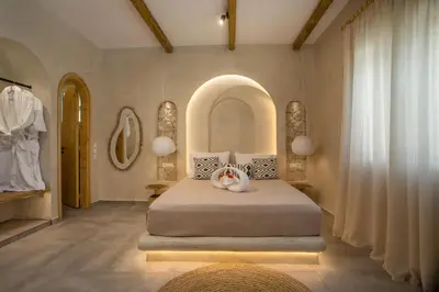 a bedroom with a large bed with flowers on it at Saint Zoe Suites in Rhodes Town