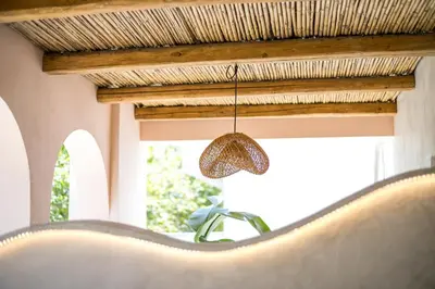 a pendant light hanging from a ceiling in a room at Saint Zoe Suites in Rhodes Town