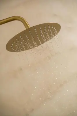 a shower head with water pouring out of it at Saint Zoe Suites in Rhodes Town