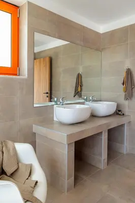 a bathroom with two sinks and a mirror at Villa Seven in Lachania