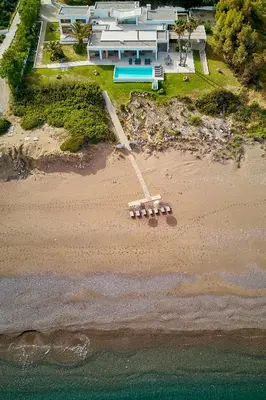 an aerial view of a beach with a house at Villa Seven in Lachania