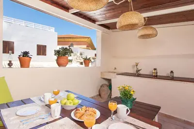 a dining room table with food and drinks on it at Studio Astero in Rhodes Town