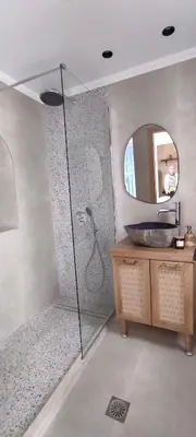 a bathroom with a shower with a sink and a mirror at Casa Stergia - Village Project in Psinthos