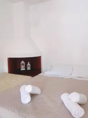 a bed with three towels on top of it at Sofia’s Studio in Arnítha