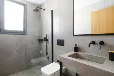 a bathroom with a shower and a sink and a toilet at Villa Dolce Vita Evelia by Villa Plus in Ialyssos