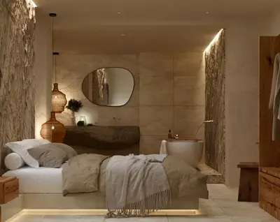 a bedroom with a bed and a sink and a tub at Elaia Luxury House in Archangelos