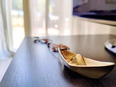 a bowl on a table with a chain on it at Villa Libre Mare, your cozy vacation villa in Pefki Rhodes