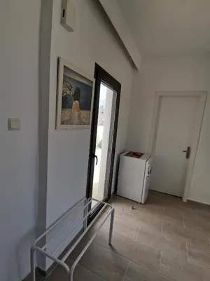 a room with a stairway with a door and a window at 3rd floor apartment in town with sea view in Rhodes Town