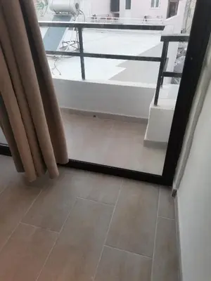 a bathroom with a tub and a tile floor at 3rd floor apartment in town with sea view in Rhodes Town