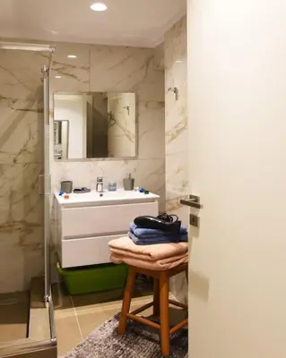 a bathroom with a sink and a shower at Uni cozy city apartment in Rhodes Town