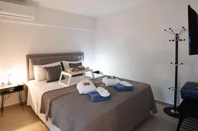 a bedroom with a bed with towels on it at Uni cozy city apartment in Rhodes Town