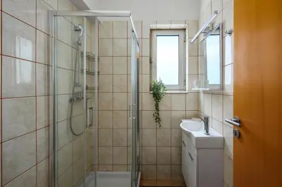 a bathroom with a shower and a toilet and a sink at Elli Beach Downtown Apartments in Rhodes Town