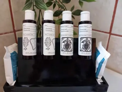 a group of four bottles of wine on a shelf at Elli Beach Downtown Apartments in Rhodes Town