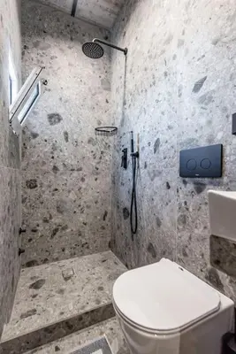 a bathroom with a shower with a toilet and a sink at Smart Luxury Apartments #1 in Rhodes Town