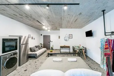 a living room with a couch and a table at Smart Luxury Apartments #1 in Rhodes Town