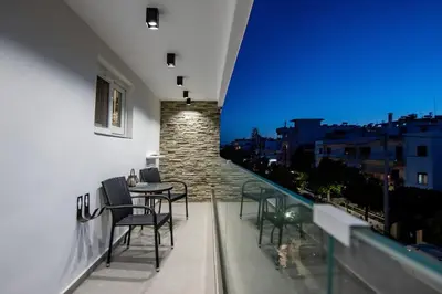 a balcony with chairs and a table on a building at Smart Luxury Apartments #1 in Rhodes Town