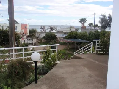 a view from the balcony of a house with a white fence at Antouan Matina in Archangelos