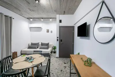 a living room with a table and a couch at Smart Luxury Apartments #2 in Rhodes Town