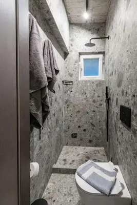 a small bathroom with a toilet and a window at Smart Luxury Apartments #2 in Rhodes Town
