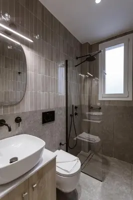 a bathroom with a sink and a toilet and a shower at Luxury Apartments Of Colossus in Rhodes Town