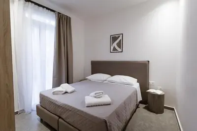 a bedroom with a bed with two towels on it at Luxury Apartments Of Colossus in Rhodes Town