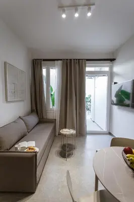 a living room with a couch and a table at Luxury Apartments Of Colossus in Rhodes Town