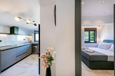 a kitchen and a bedroom with a bed in a room at Rhodes Center Luxury Apartments #1 in Rhodes Town