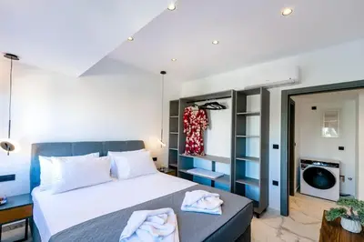 a bedroom with a bed with towels on it at Rhodes Center Luxury Apartments #1 in Rhodes Town