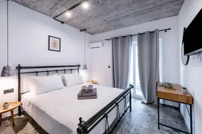 a bedroom with a bed with towels on it at Smart Luxury Apartments #3 in Rhodes Town