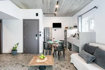 a living room with a couch and a table at Smart Luxury Apartments #3 in Rhodes Town