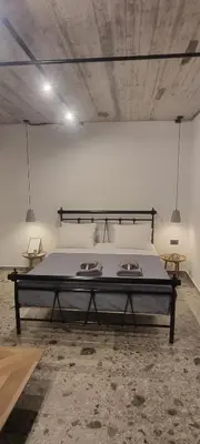 a bedroom with a large bed in a room at Smart Luxury Apartments #3 in Rhodes Town