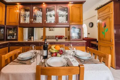 a kitchen with a table with a bowl of fruit on it at Casa Garden in Archangelos