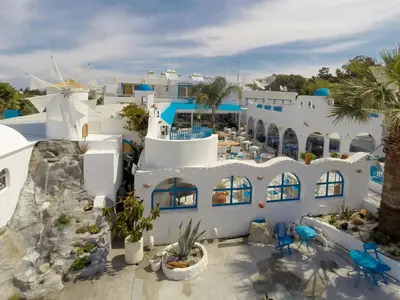 an aerial view of a white building with palm trees at Romantza Mare in Kallithea Rhodes