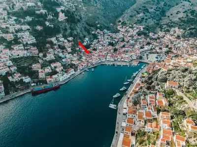 an aerial view of a town next to the water at Ilioni Apartment in Symi