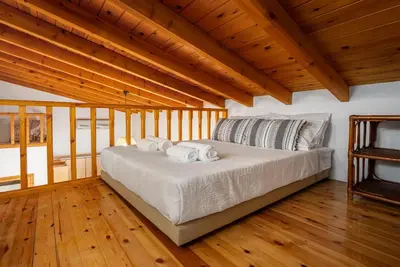 a bedroom with a bed with two towels on it at Ilioni Apartment in Symi