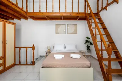 a bedroom with a bed with two towels at Lito Studio in Symi