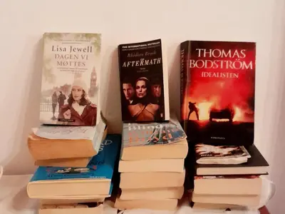 a group of books sitting on top of each other at 