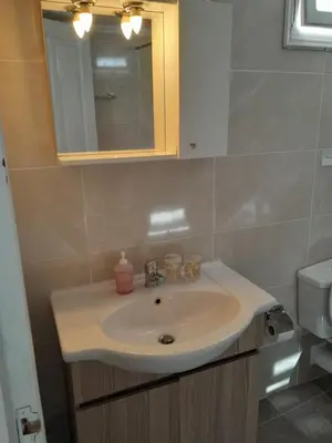 a bathroom with a sink and a mirror at 