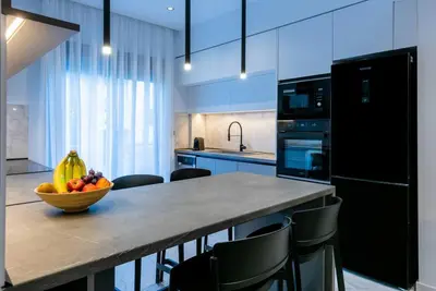 a kitchen with a bowl of fruit on a counter at Rhodes Center Luxury Apartments #2 in Rhodes Town