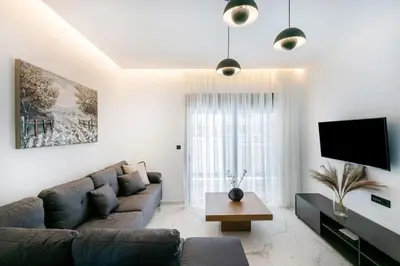 a living room with a couch and a tv at Rhodes Center Luxury Apartments #2 in Rhodes Town