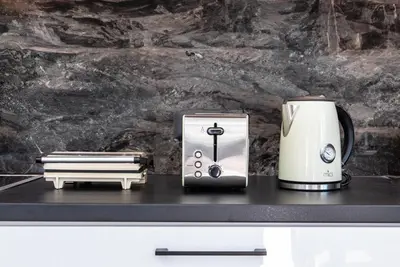 a toaster and a coffee maker on a counter at Katris Luxury Homes #1 in Triánta