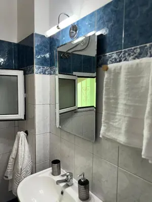 a bathroom with a sink and a mirror at The Sunlit Retreat in Kremasti
