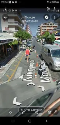 a picture of a street with a person walking down the street at Anerades city center apartment in Rhodes Town