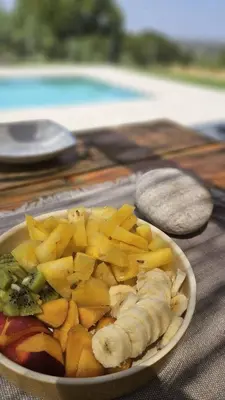 a plate of fruit and vegetables on a table at Imagio 22 in Sálakos